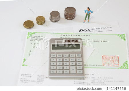 iDeCo stamps and calculator, miniature figures standing next to piles of money, an image of asset building, retirement funds. iDeCo stamps and calculator, miniature figures standing next to piles of money, an image of asset building, retirement funds. 141147336