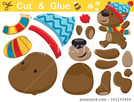Funny bear cartoon wearing winter hat and scarf. Education paper game for children. Cutout and gluing Funny bear cartoon wearing winter hat and scarf. Education paper game for children. Cutout and gluing 141147454