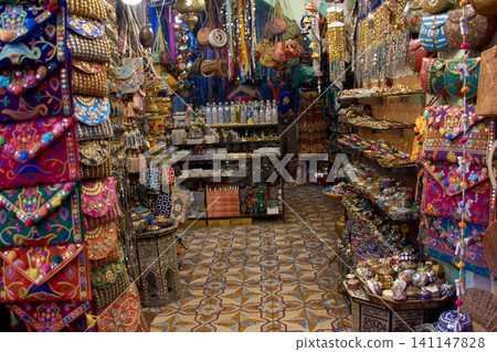 A local craft shop with embroidered bags and decorative boxes in the old Marrakech souk A local craft shop with embroidered bags and decorative boxes in the old Marrakech souk 141147828