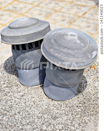 Industrial ventilation and air conditioning systems installed on the flat roof of a commercial building. Industrial ventilation and air conditioning systems installed on the flat roof of a commercial building. 141149025