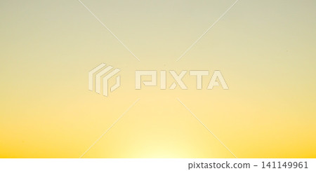 The setting sun has painted the sky golden, creating a scene that suggests something good is about to happen. The setting sun has painted the sky golden, creating a scene that suggests something good is about to happen. 141149961