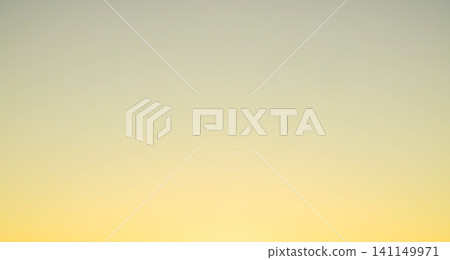 The setting sun has painted the sky golden, creating a scene that suggests something good is about to happen. The setting sun has painted the sky golden, creating a scene that suggests something good is about to happen. 141149971