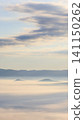 Mountain range covered in a sea of clouds 141150262