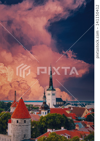 St. Olaf's Church spire and defensive walls under dramatic clouds St. Olaf's Church spire and defensive walls under dramatic clouds 141150412