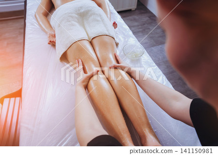 Young girl is relaxing in the spa. 141150981