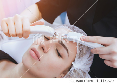 Young girl is relaxing in the spa. 141150982