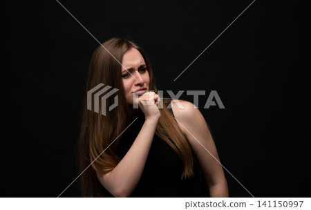 Young woman showing disgust and aversion, expressing negative emotions and revulsion with a displeased face Young woman showing disgust and aversion, expressing negative emotions and revulsion with a displeased face 141150997