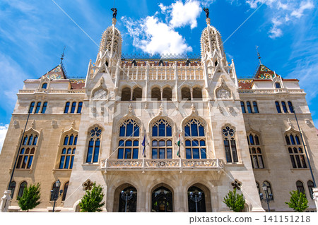 Budapest, Hungary: The magnificent exterior of the former Ministry of Finance (Royal Ministry of Finance of Hungary), with its beautiful mosaic roof standing out against the blue sky. Budapest, Hungary: The magnificent exterior of the former Ministry of Finance (Royal Ministry of Finance of Hungary), with its beautiful mosaic roof standing out against the blue sky. 141151218