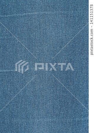 Blue denim fabric texture close up. Classic jeans material background with detailed twill weave Blue denim fabric texture close up. Classic jeans material background with detailed twill weave 141151378