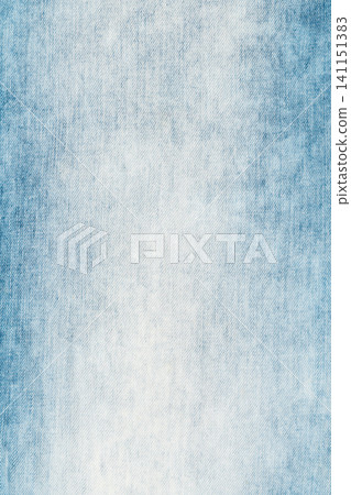 Light blue denim fabric texture background. Worn jeans cloth pattern with faded cotton textile 141151383