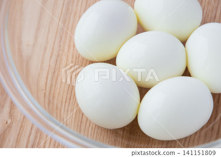 Peeled hard-boiled eggs in a glass bowl Peeled hard-boiled eggs in a glass bowl 141151809
