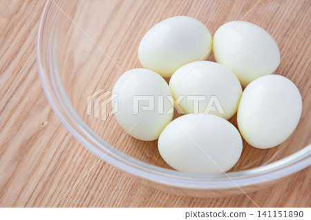 Peeled hard-boiled eggs in a glass bowl Peeled hard-boiled eggs in a glass bowl 141151890