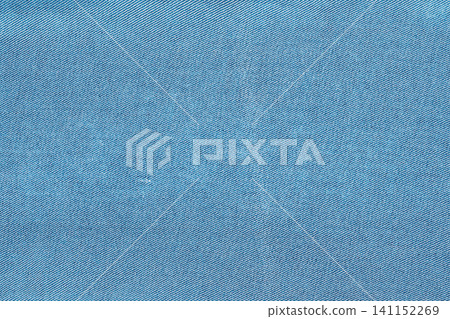 Blue denim fabric texture closeup with diagonal weave pattern Blue denim fabric texture closeup with diagonal weave pattern 141152269