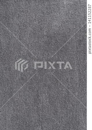 Gray denim fabric texture background. Closeup of dark grey woven cloth with diagonal pattern Gray denim fabric texture background. Closeup of dark grey woven cloth with diagonal pattern 141152287