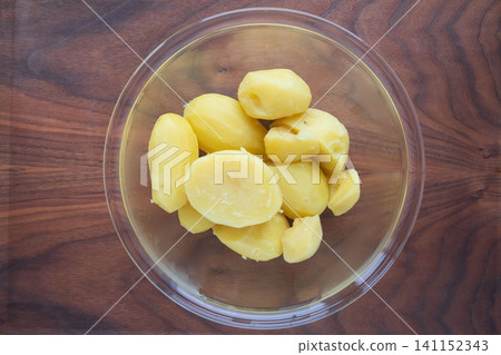 Steamed potatoes in a glass bowl Steamed potatoes in a glass bowl 141152343