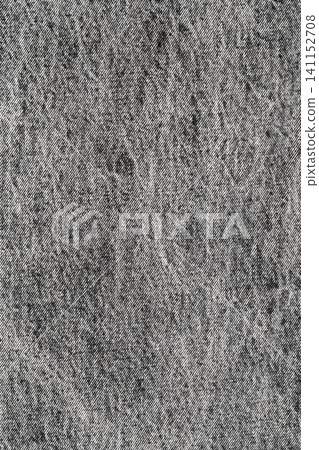 Black and white denim fabric texture. Macro shot of grey jean material with diagonal weave Black and white denim fabric texture. Macro shot of grey jean material with diagonal weave 141152708