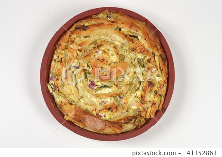 Baked Savory Spiral Pastry with Cheese and Vegetables in a Round Pan Baked Savory Spiral Pastry with Cheese and Vegetables in a Round Pan 141152861