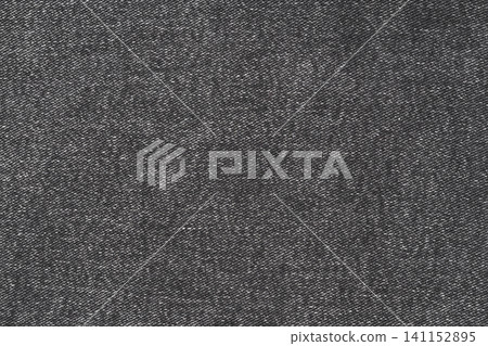 Dark gray denim fabric texture closeup. Black twill weave material background Dark gray denim fabric texture closeup. Black twill weave material background 141152895