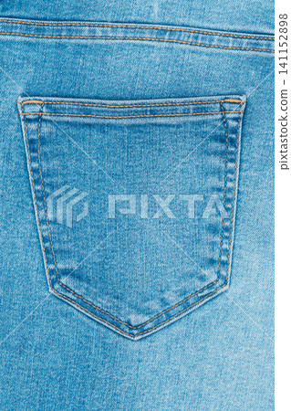 Blue denim jeans back pocket with yellow stitching close up Blue denim jeans back pocket with yellow stitching close up 141152898