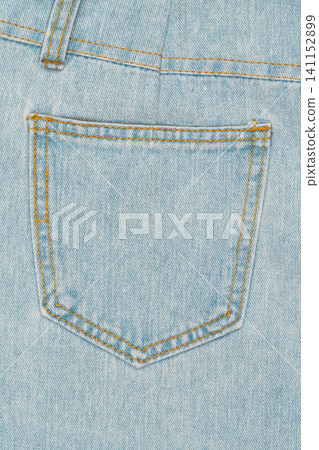 Light blue denim jeans back pocket close up Light blue denim jeans back pocket close up 141152899