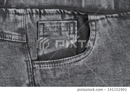 Black denim jeans pocket close up with detailed fabric texture and stitching Black denim jeans pocket close up with detailed fabric texture and stitching 141152901