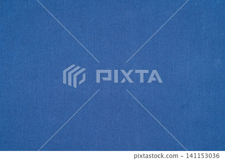 Solid blue fabric texture background with even lighting and subtle weave pattern Solid blue fabric texture background with even lighting and subtle weave pattern 141153036