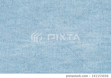 Light blue denim fabric texture closeup with diagonal weave pattern and subtle fading Light blue denim fabric texture closeup with diagonal weave pattern and subtle fading 141153038