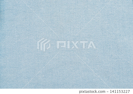 Light blue fabric texture with diagonal weave pattern Light blue fabric texture with diagonal weave pattern 141153227