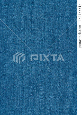 Blue denim fabric texture background. Close up of classic jeans material with detailed cotton weave Blue denim fabric texture background. Close up of classic jeans material with detailed cotton weave 141153312