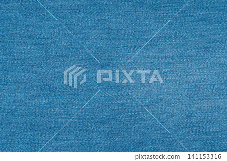 Blue denim fabric texture background. Close up of classic jeans textile material Blue denim fabric texture background. Close up of classic jeans textile material 141153316
