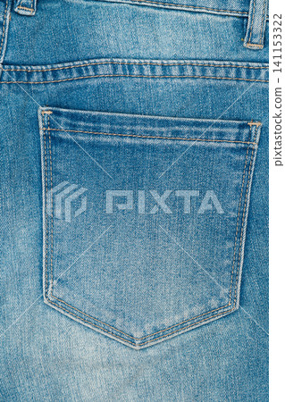 Blue jeans back pocket closeup. Denim fabric texture with stitching. Classic casual style background Blue jeans back pocket closeup. Denim fabric texture with stitching. Classic casual style background 141153322