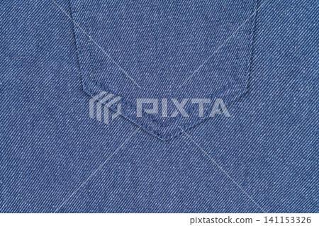 Blue denim fabric texture with seam detail. Close up of jeans material background Blue denim fabric texture with seam detail. Close up of jeans material background 141153326
