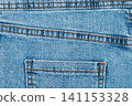 Blue denim jeans texture with back pocket and orange stitching 141153328