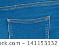Blue denim jeans texture with back pocket and orange stitching 141153332
