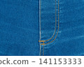 Classic blue denim background with golden thread seam on fly 141153333