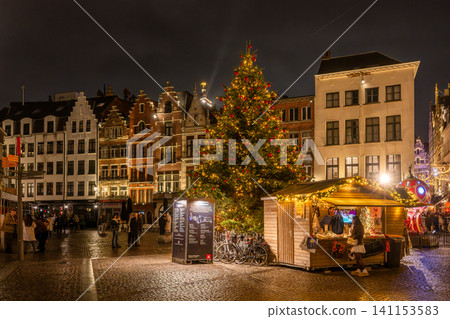 Christmas tree and market at night in front of the Cathedral of Our Lady in Antwerp, Belgium. Christmas tree and market at night in front of the Cathedral of Our Lady in Antwerp, Belgium. 141153583