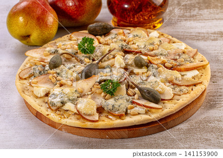 Gourmet pear blue cheese flatbread pizza with pine nuts and capers Gourmet pear blue cheese flatbread pizza with pine nuts and capers 141153900