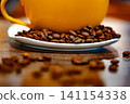 Cup of coffee and coffee beans on a white plate. dark background 141154338