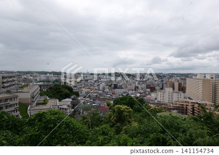 Japanese Residential Street with Modern Family Houses in Quiet Neighborhood Japanese Residential Street with Modern Family Houses in Quiet Neighborhood 141154734