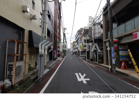 Japanese Residential Street with Modern Family Houses in Quiet Neighborhood Japanese Residential Street with Modern Family Houses in Quiet Neighborhood 141154752