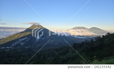 This is sunrise and fog in Ijen Mountain in East Java, Indonesia This is sunrise and fog in Ijen Mountain in East Java, Indonesia 141155342