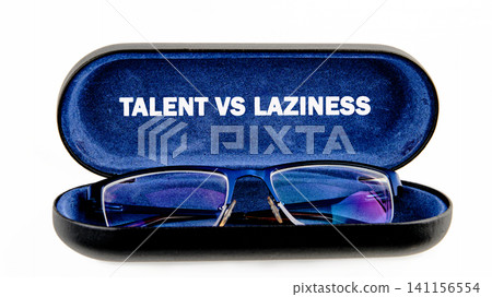 A black glasses case is open showing a pair of glasses inside. The inner surface of the case has the words talent vs laziness printed on it A black glasses case is open showing a pair of glasses inside. The inner surface of the case has the words talent vs laziness printed on it 141156554
