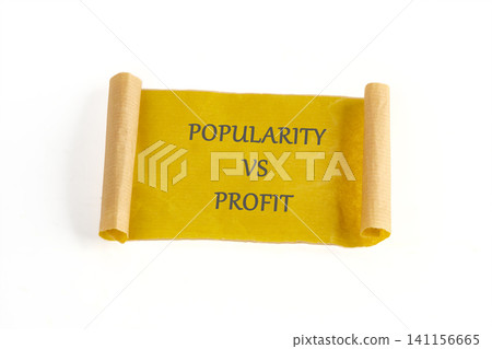 A scroll displays the words popularity vs profit. This scene shows a simple representation of a business topic. The scroll is rolled at both ends for a clear view A scroll displays the words popularity vs profit. This scene shows a simple representation of a business topic. The scroll is rolled at both ends for a clear view 141156665
