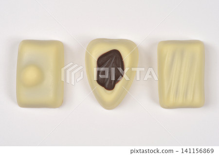 Three Assorted White Chocolate Pralines on White Background Three Assorted White Chocolate Pralines on White Background 141156869