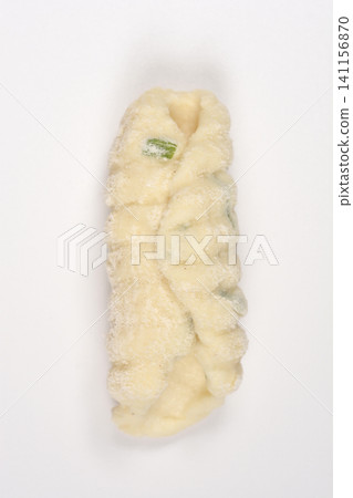 Single Piece of Raw Cottage Cheese Gnocchi with Chives 141156870