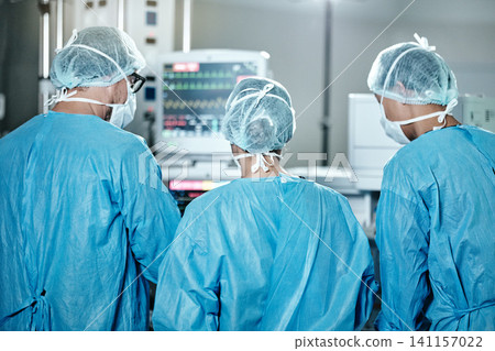 Surgery, group or surgeons with teamwork for emergency, accident or healthcare in hospital clinic. Heart rate monitor, back or doctors in surgical collaboration for operating, support or medical help Surgery, group or surgeons with teamwork for emergency, accident or healthcare in hospital clinic. Heart rate monitor, back or doctors in surgical collaboration for operating, support or medical help 141157022