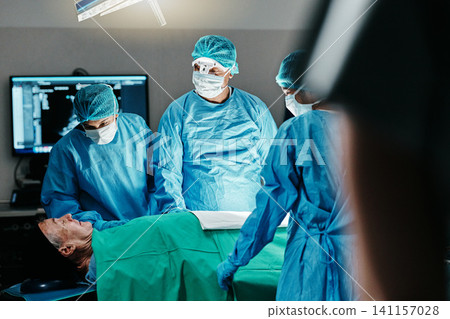 Medical, surgery or doctors in operating room with theater patient or trauma unit for anatomy emergency. Healthcare, support and surgeon team consulting sick man at hospital with empathy and comfort 141157028