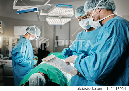Healthcare, surgery and doctors with patient, chart and advice in theater for medical emergency. Hospital, expert and surgical team for operation on person in ICU for professional help with stats Healthcare, surgery and doctors with patient, chart and advice in theater for medical emergency. Hospital, expert and surgical team for operation on person in ICU for professional help with stats 141157034