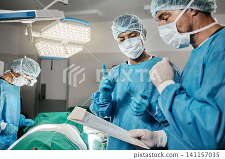 Surgery, documents or surgeons with teamwork for emergency, accident or healthcare in hospital. Paperwork, medical checklist or doctors in surgical collaboration in operating room to support or help Surgery, documents or surgeons with teamwork for emergency, accident or healthcare in hospital. Paperwork, medical checklist or doctors in surgical collaboration in operating room to support or help 141157035