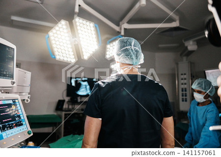 Healthcare, surgery or doctors in operating room, theater or trauma unit for anatomy emergency. Medical, support and surgeon people consulting at hospital with Xray, inspection or procedure planning Healthcare, surgery or doctors in operating room, theater or trauma unit for anatomy emergency. Medical, support and surgeon people consulting at hospital with Xray, inspection or procedure planning 141157061
